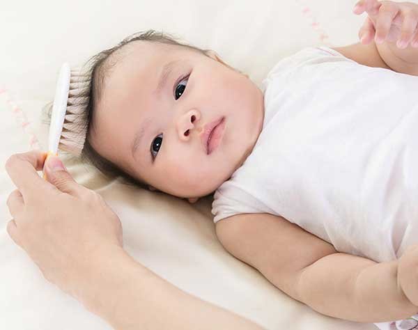 13 Tips to Make Baby Hair Grow Fast: Brush your baby’s scalp